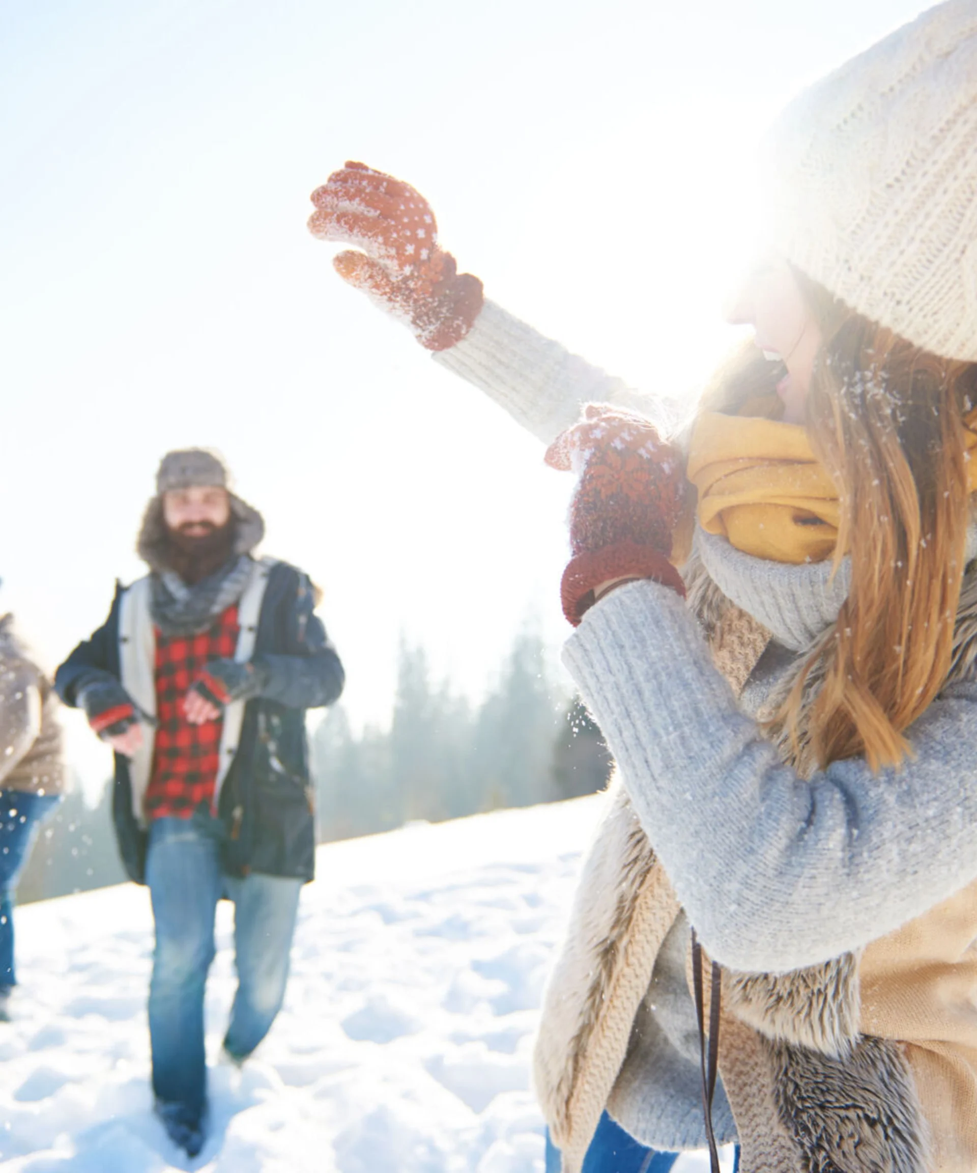 Friends enjoying a snowy day in Montana — sell your Western Montana home with MT Lux Real Estate.